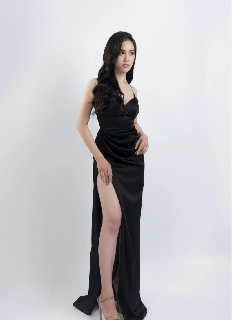 Woman wearing a black column evening gown